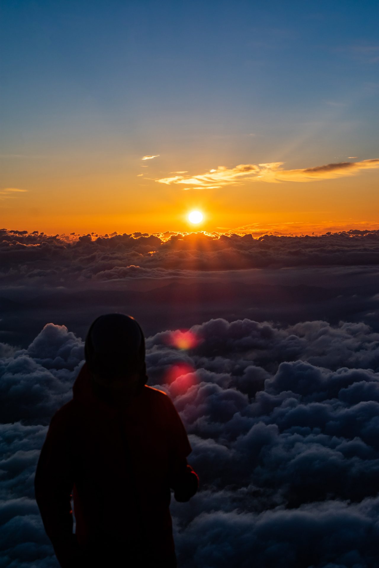 Sunrise on the top of mount Fuji over the clouds in Japan