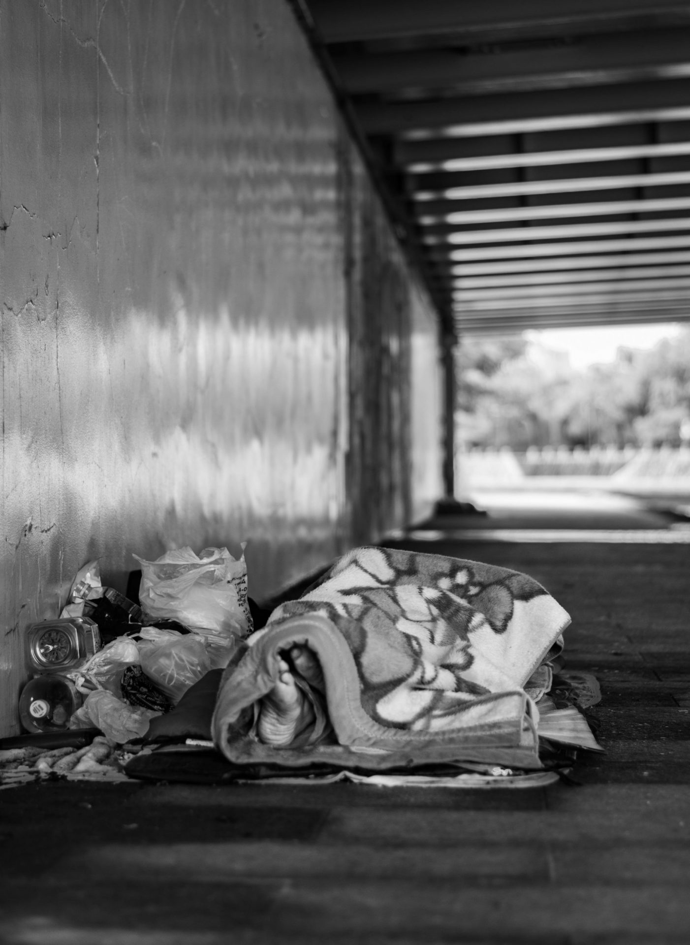 Homeless man sleeping under the bridge