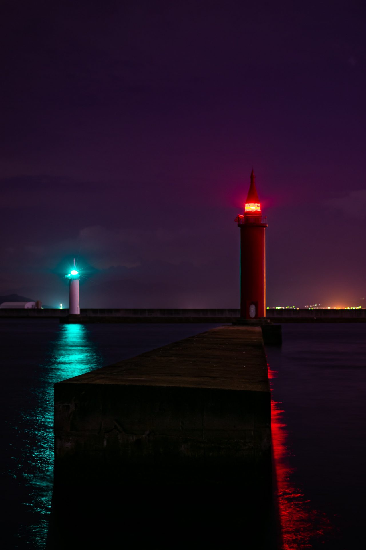 A red and white lighthouse providing the light during the night