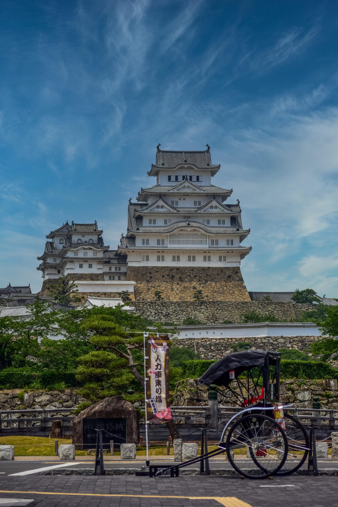 Himeji castle with a riksha in the foreground