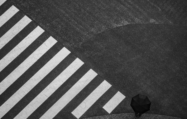 Minimalistic black and white photograph at the famous Shibuya crossing